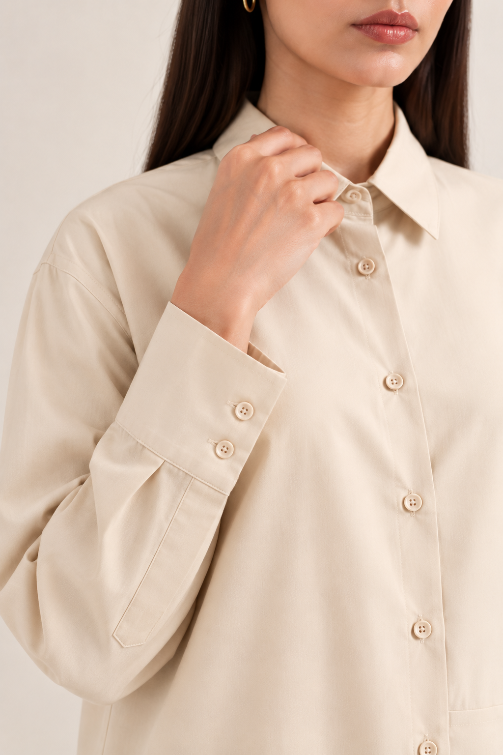 Close-up of ivory shirt collar and button detailing in imported khaddar