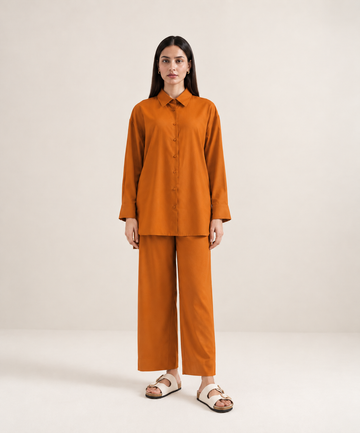 Rust-orange imported khaddar co-ord set with collared shirt and wide-leg trousers