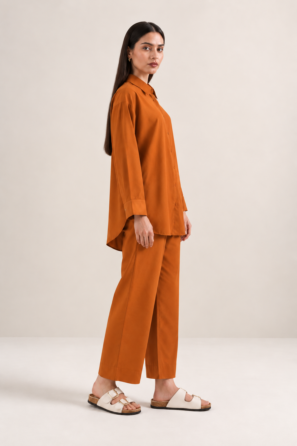 Close-up of rust-orange button-down shirt in imported khaddar